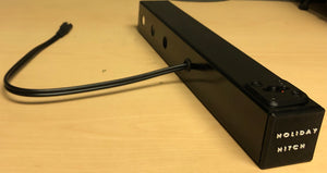 Holiday Hitch™ is used to support and power decorative items.